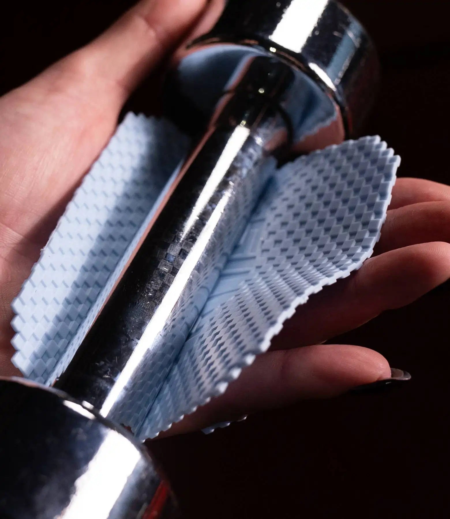blue sillygrip pad around small shiny dumbell