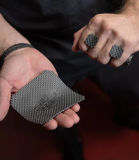 Man holding textured sillygrip lifting pads