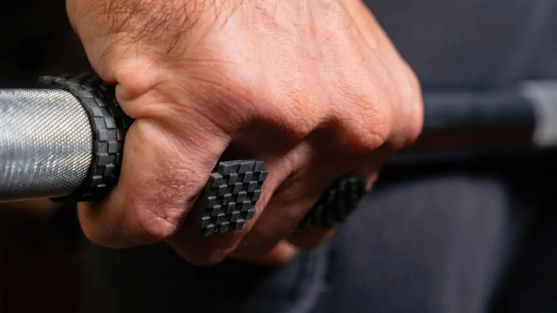 weight lifting grip pad between hand and the bar